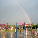 rainbow over a childrens playground