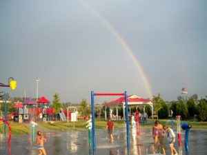 rainbow over a childrens playground